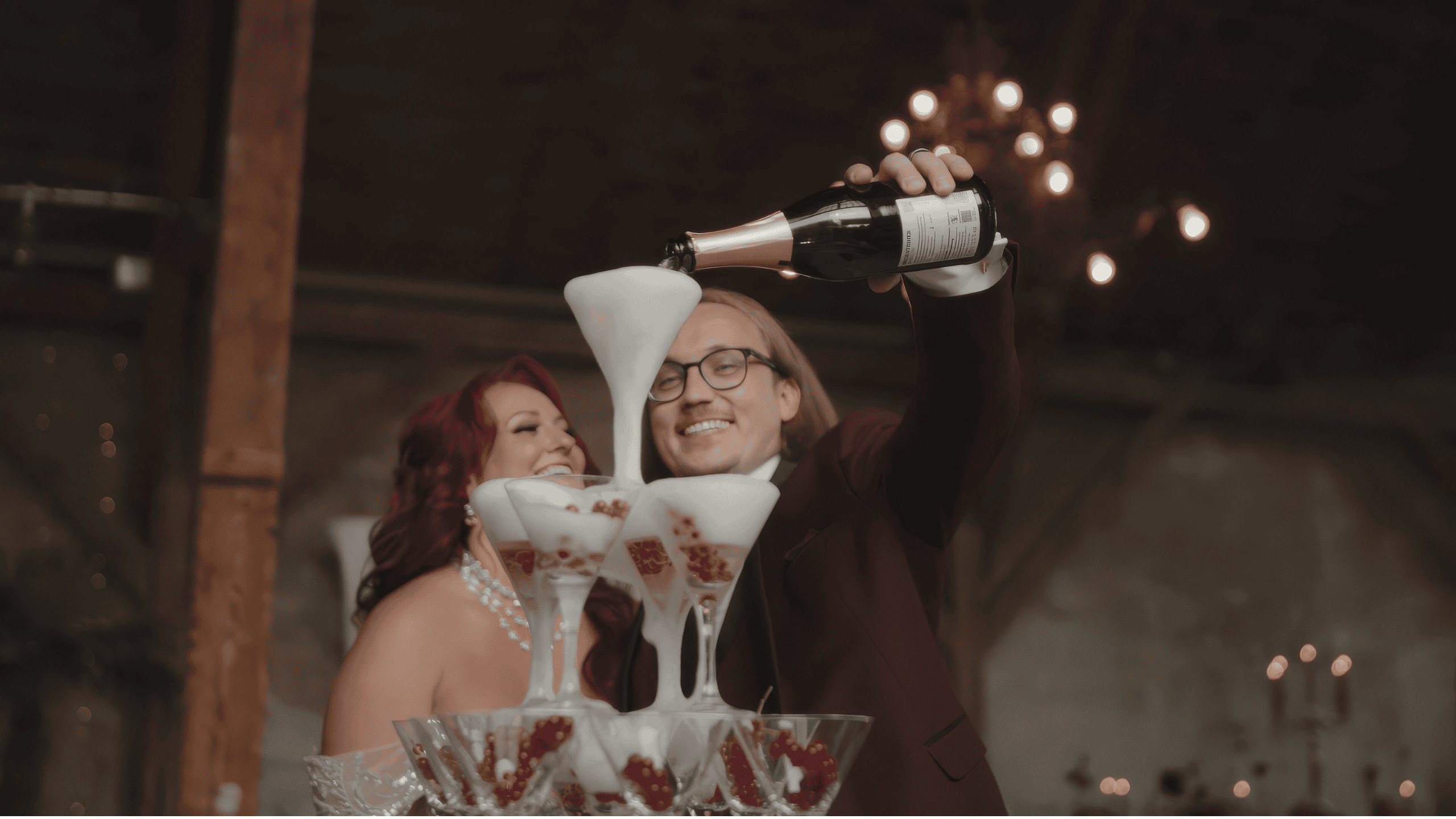 Couple celebrating their destination wedding in Germany with a champagne tower at Schloss Langenburg.